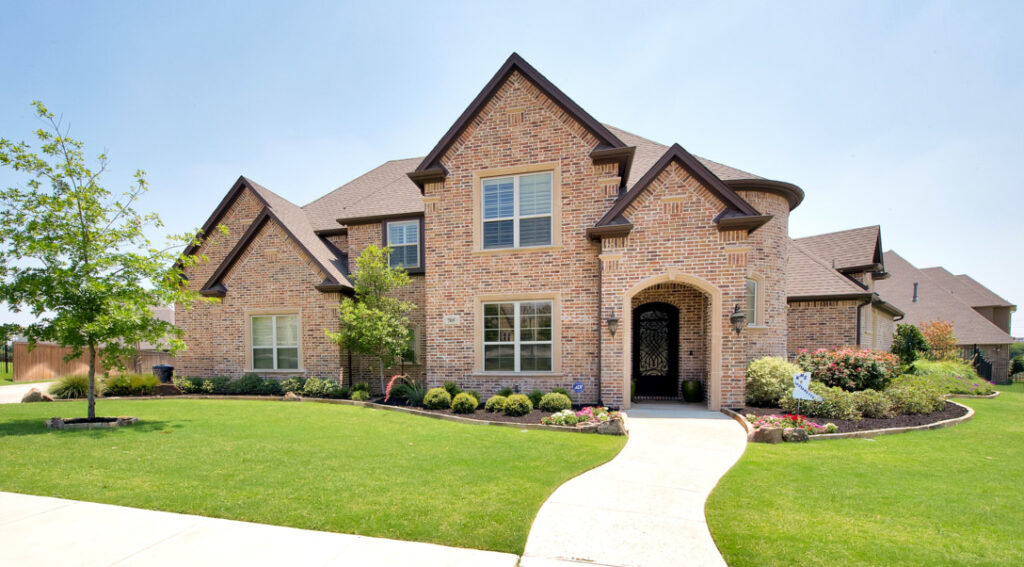 View of exterior property of luxury custom estate built in Keller Texas.