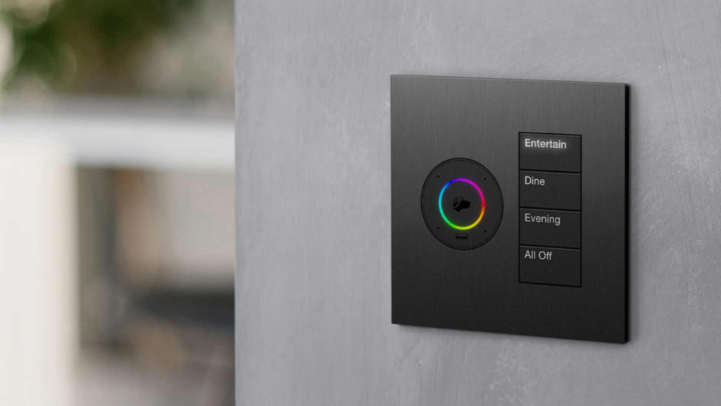 Lutron HomeWorks smart keypad with color dial and lighting scene buttons for entertain, dine, evening, and all off mounted on wall.