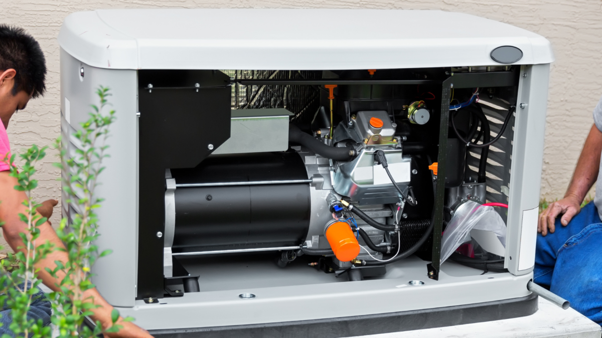 Whole-home standby generator with access panel open, showing internal components used for backup power during outages.