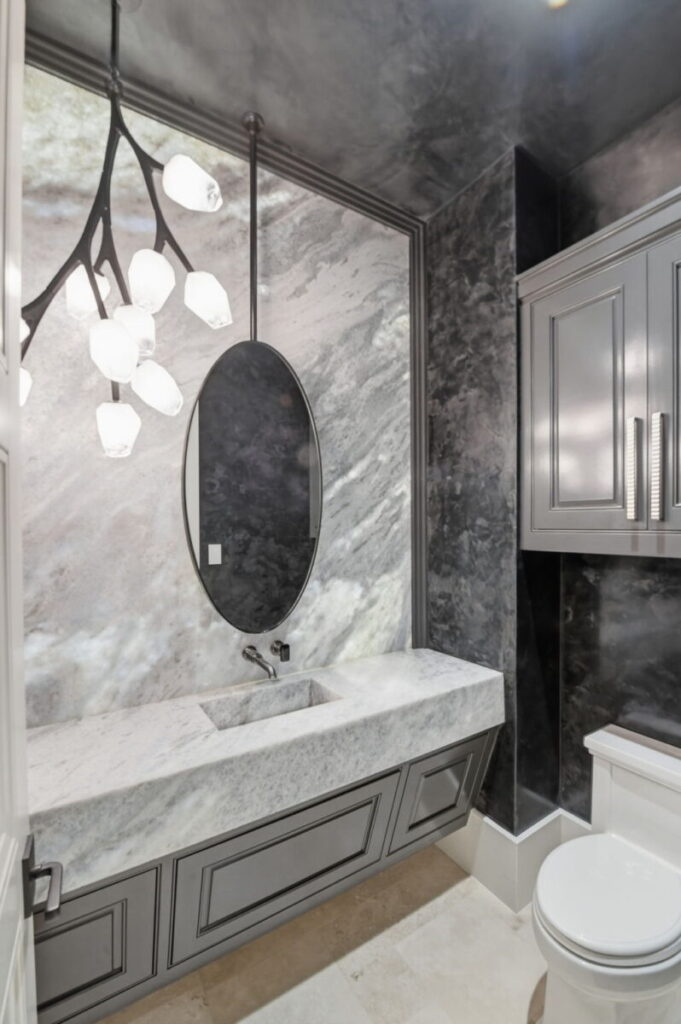 Lutron Ketra Lighting with custom modern backlit wall and Ferguson Home lighting element.