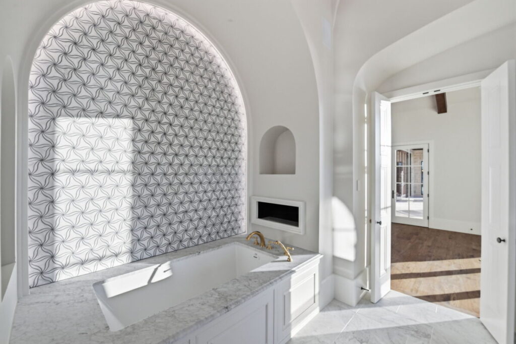 Backlit spa wall in master bath of Lakeside Villa in Westlake Quail Hollow.