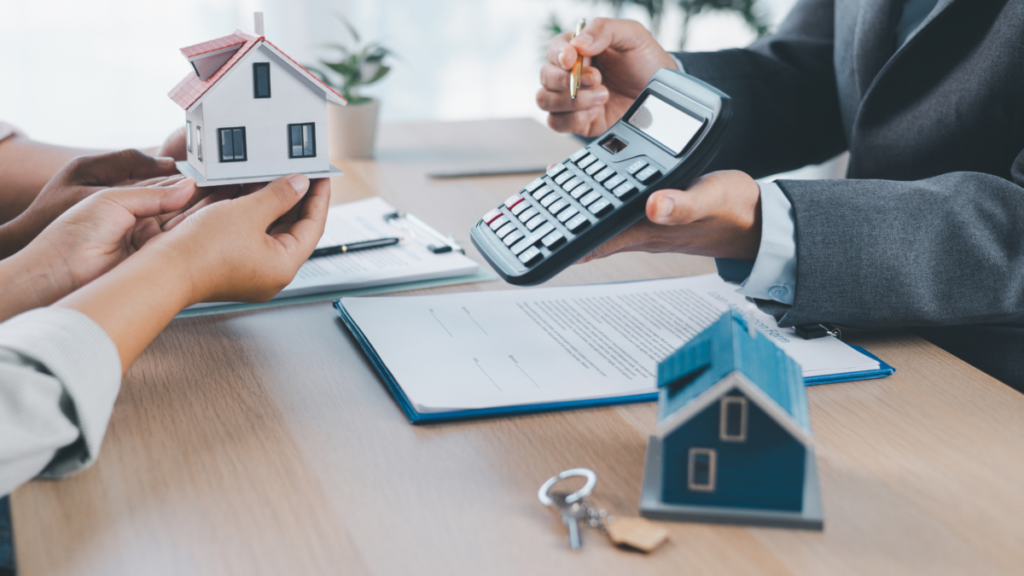 Lender calculating price of new custom home for Owners with a contract and 3D model of home on the desk.