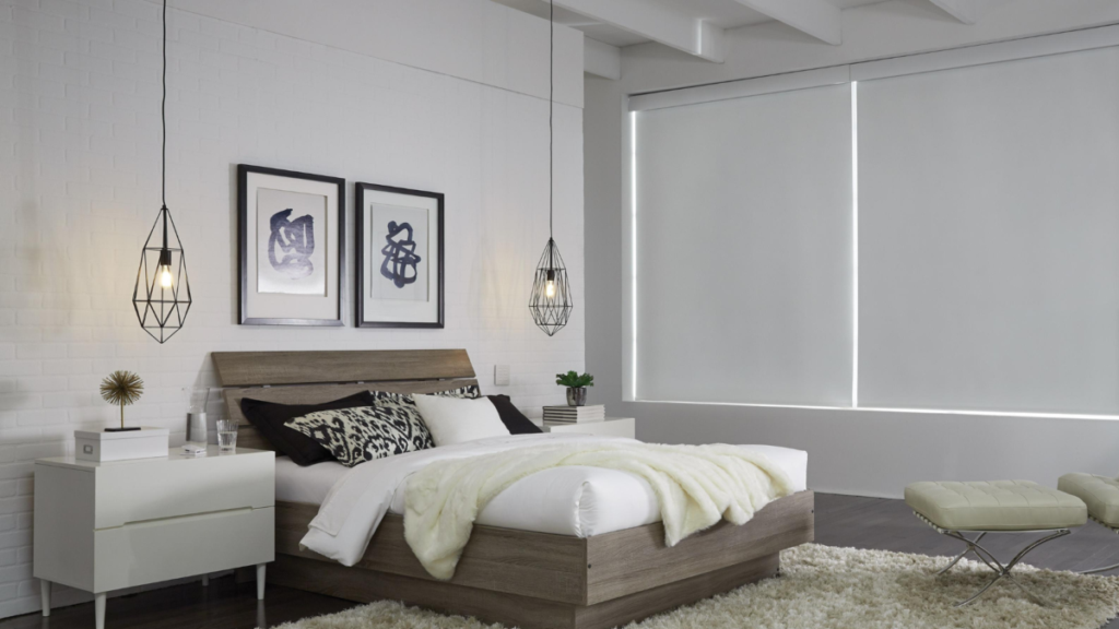 Modern bedroom with Lutron automated roller shades, pendant lighting, and minimalist decor.