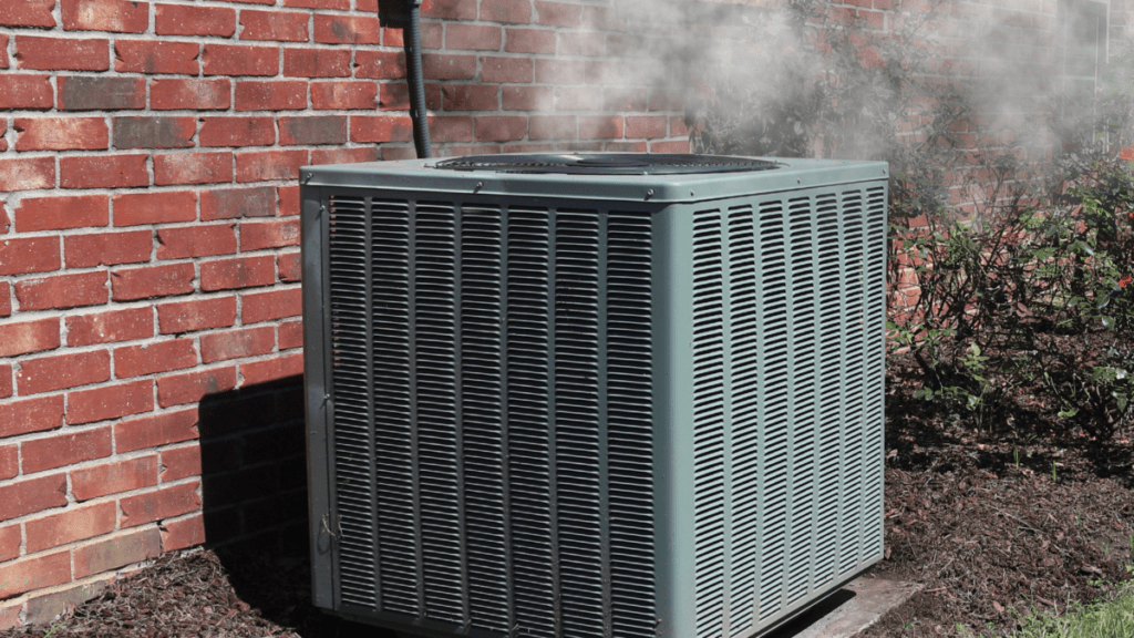 HVAC system outside of custom home smoking indicating a problem.