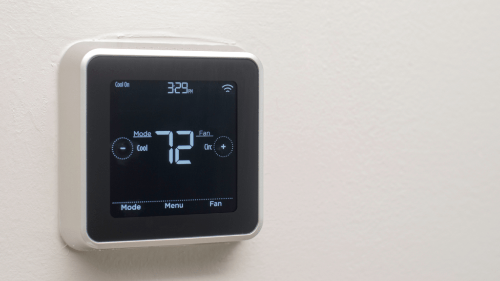 Thermostat on wall showing a cool 72 degrees.